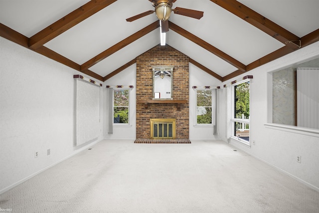 unfurnished living room featuring a ceiling fan, carpet flooring, a brick fireplace, and baseboards
