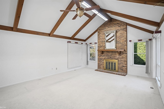 unfurnished living room with a ceiling fan, carpet, and plenty of natural light