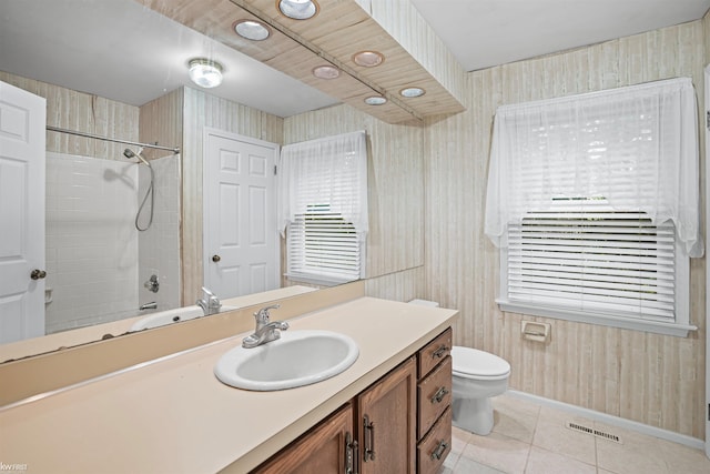 full bathroom with tile patterned floors, vanity, baseboards, and toilet