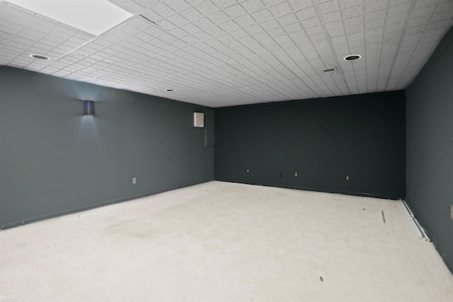 finished basement featuring light colored carpet