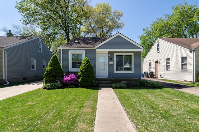 bungalow-style home featuring a front yard