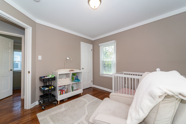 bedroom featuring baseboards and wood finished floors