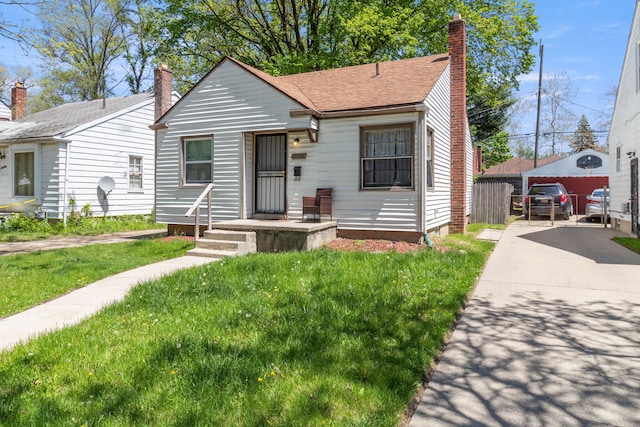 19720 Asbury Park, Detroit, MI 48235 - bungalow-style house with a chimney and a shingled roof