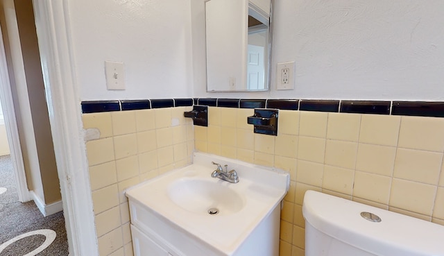 19720 Asbury Park, Detroit, MI 48235 - half bathroom with toilet, tile walls, vanity, and wainscoting