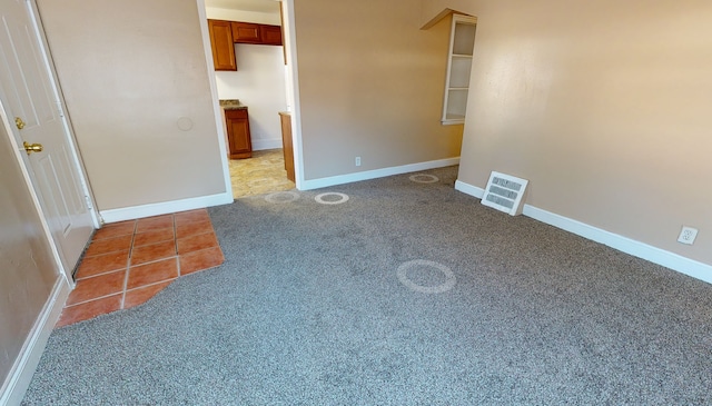 19720 Asbury Park, Detroit, MI 48235 - tiled spare room with carpet flooring and baseboards