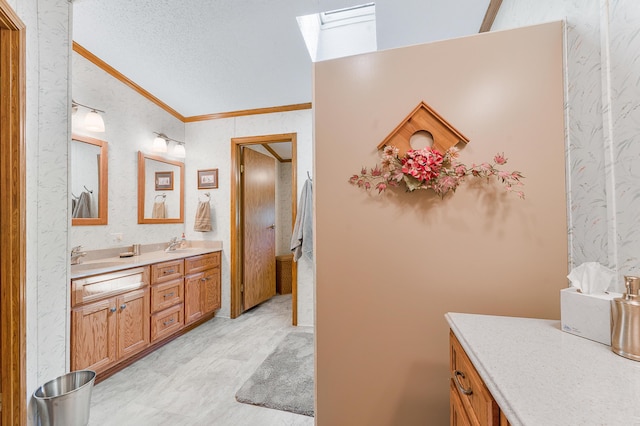 19251 Indian Dr, Paris, MI 49338 - full bath with a skylight, ornamental molding, double vanity, a textured ceiling, and wallpapered walls
