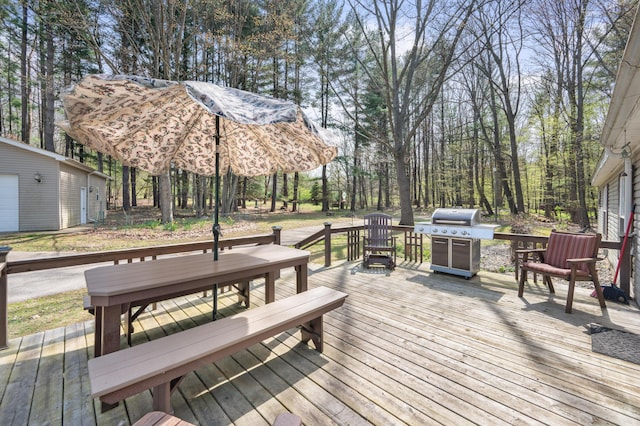 19251 Indian Dr, Paris, MI 49338 - wooden deck featuring an outdoor structure, area for grilling, and outdoor dining area