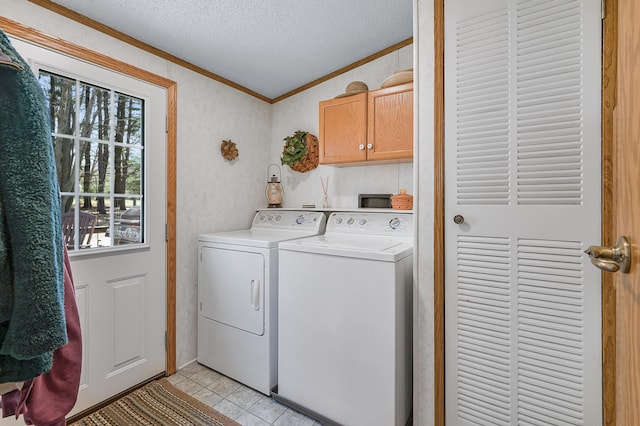 19251 Indian Dr, Paris, MI 49338 - laundry room featuring ornamental molding, cabinet space, washer and clothes dryer, a textured ceiling, and light tile patterned flooring