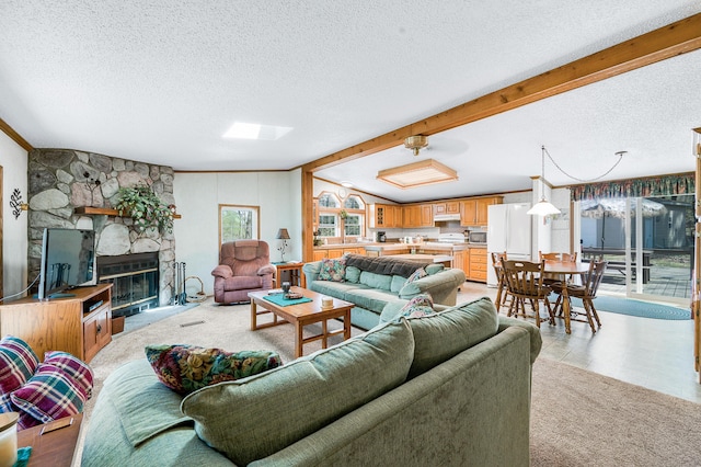 19251 Indian Dr, Paris, MI 49338 - living room with a textured ceiling, a fireplace, beam ceiling, and light carpet
