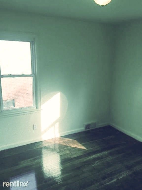 20244 Fairport St, Detroit, MI 48205 - unfurnished room featuring baseboards and wood finished floors