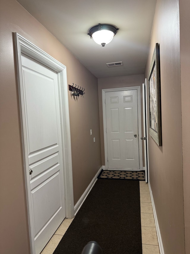 11702 Weingartz E, Utica, MI 48315 - doorway with light tile patterned floors and baseboards