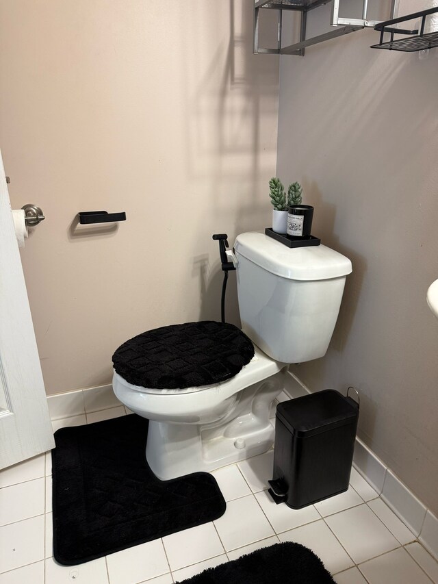 11702 Weingartz E, Utica, MI 48315 - half bathroom with toilet, tile patterned flooring, and baseboards