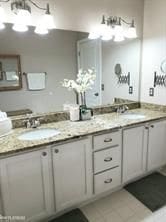 11702 Weingartz E, Utica, MI 48315 - bathroom with tile patterned floors and double vanity