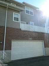 11702 Weingartz E, Utica, MI 48315 - view of side of property with an attached garage and a balcony