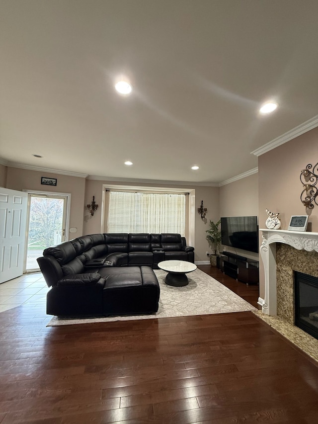 11702 Weingartz E, Utica, MI 48315 - living room with ornamental molding, recessed lighting, a premium fireplace, wood finished floors, and baseboards