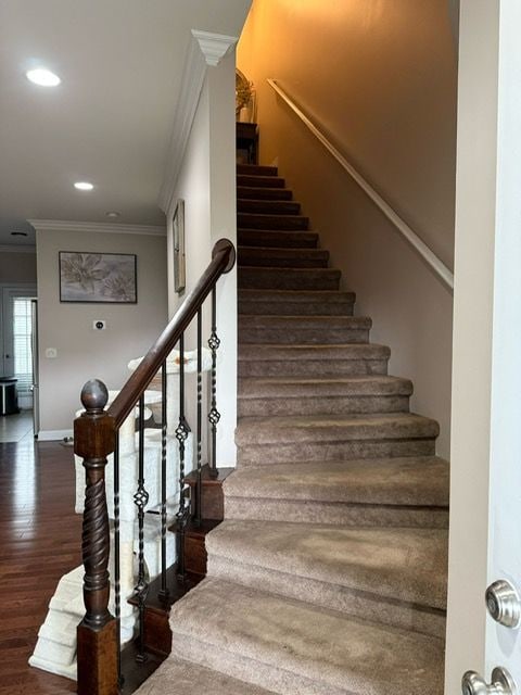 11702 Weingartz E, Utica, MI 48315 - staircase with ornamental molding, wood finished floors, baseboards, and recessed lighting