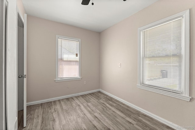 19327 Sunset St, Detroit, MI 48234 - unfurnished bedroom with wood finished floors, baseboards, and ceiling fan