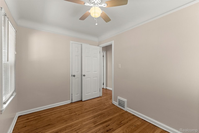 19327 Sunset St, Detroit, MI 48234 - spare room with wood finished floors, baseboards, ceiling fan, and ornamental molding