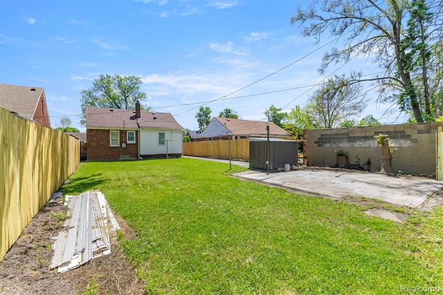 19327 Sunset St, Detroit, MI 48234 - view of yard with a patio area