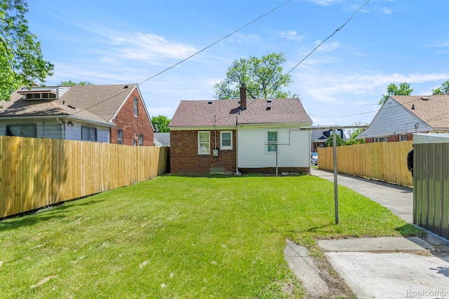 19327 Sunset St, Detroit, MI 48234 - back of house featuring a chimney and brick siding