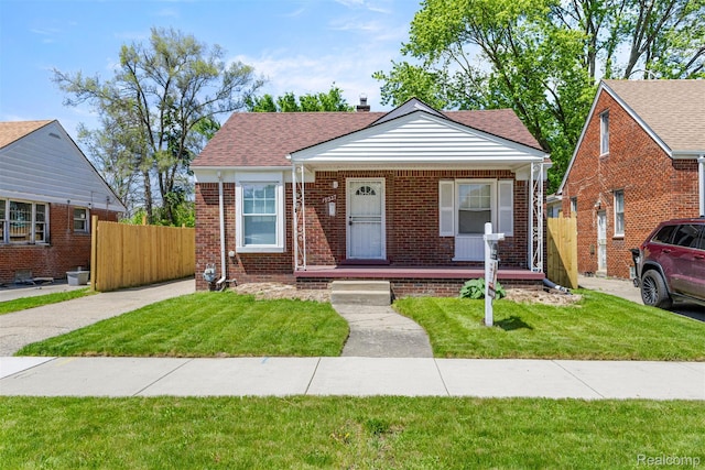 19327 Sunset St, Detroit, MI 48234 - bungalow-style house with a porch, brick siding, and a shingled roof