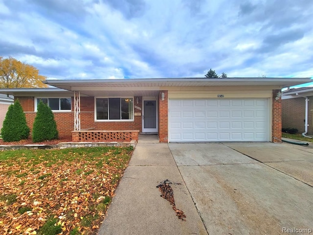28142 Liberty Dr, Warren, MI 48092 - single story home with brick siding, concrete driveway, and a garage