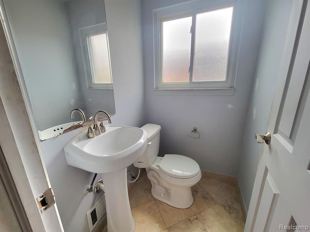 28142 Liberty Dr, Warren, MI 48092 - half bath with toilet, healthy amount of natural light, and tile patterned floors