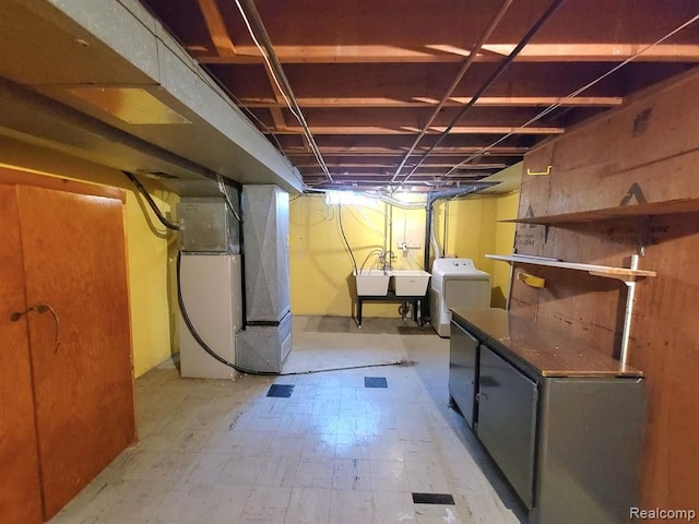 28142 Liberty Dr, Warren, MI 48092 - unfinished basement featuring washer / clothes dryer, heating unit, and light floors