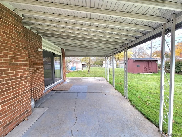 28142 Liberty Dr, Warren, MI 48092 - view of patio / terrace featuring a shed and an outbuilding