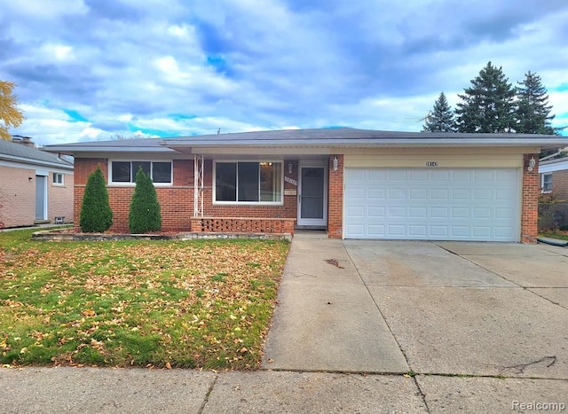 28142 Liberty Dr, Warren, MI 48092 - ranch-style house featuring brick siding, driveway, an attached garage, and a front yard