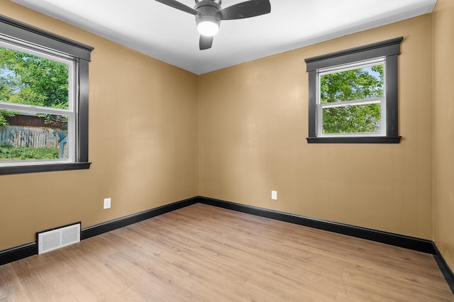 137 Wiltshire Ave, Battle Creek, MI 49015 - empty room with healthy amount of natural light, a ceiling fan, and light wood-type flooring