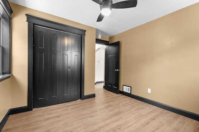 137 Wiltshire Ave, Battle Creek, MI 49015 - unfurnished bedroom featuring light wood finished floors, a closet, and ceiling fan