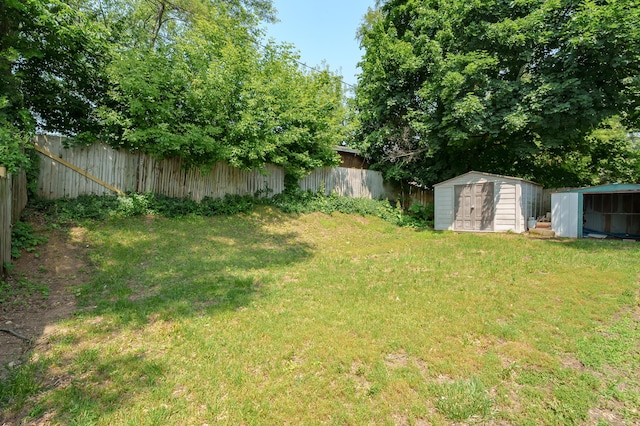 137 Wiltshire Ave, Battle Creek, MI 49015 - fenced backyard featuring a storage shed