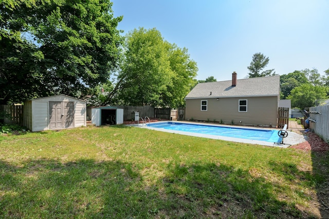 137 Wiltshire Ave, Battle Creek, MI 49015 - view of swimming pool with a storage shed and a fenced backyard