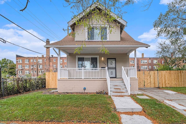 208 Hill St, Highland Park, MI 48203 - view of front facade with covered porch and a shingled roof