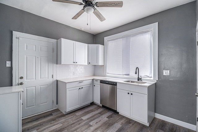 208 Hill St, Highland Park, MI 48203 - kitchen featuring dishwasher, dark wood-style flooring, a sink, white cabinetry, and a ceiling fan