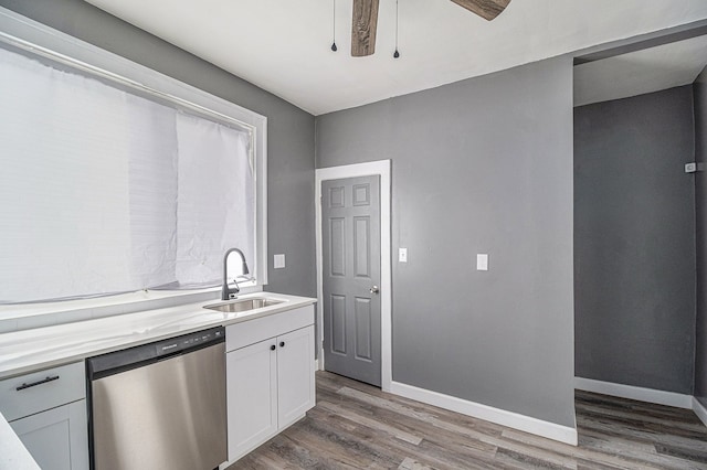 208 Hill St, Highland Park, MI 48203 - kitchen with dishwasher, a sink, wood finished floors, and light countertops