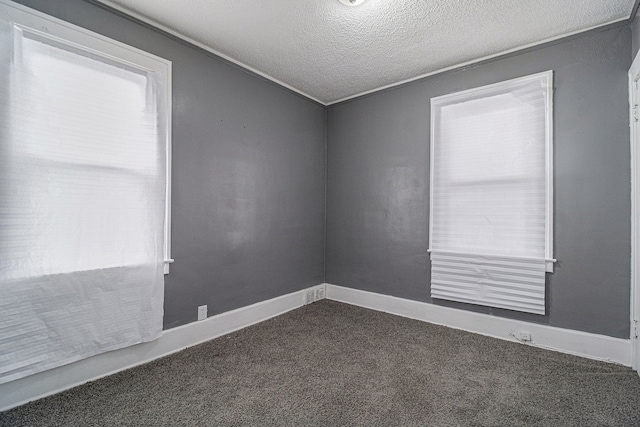 208 Hill St, Highland Park, MI 48203 - unfurnished room with dark carpet, a textured ceiling, and baseboards