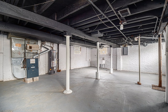 208 Hill St, Highland Park, MI 48203 - unfinished below grade area with water heater, electric panel, heating unit, and a sink