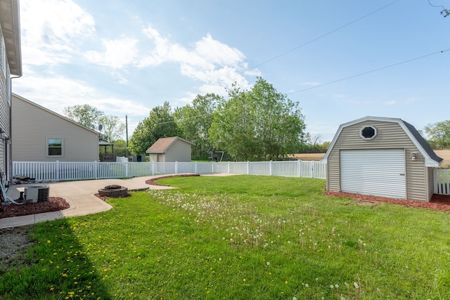 4127 Stone Post Rd, Newport, MI 48166 - view of yard with a fire pit, a storage unit, central AC unit, and an outdoor structure