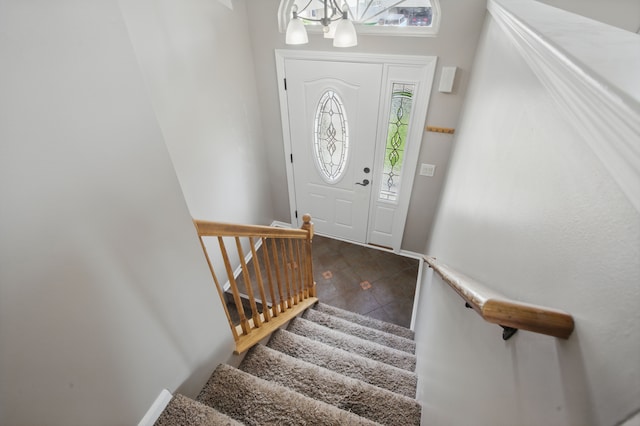 4127 Stone Post Rd, Newport, MI 48166 - entryway featuring a chandelier, stairway, baseboards, and tile patterned floors