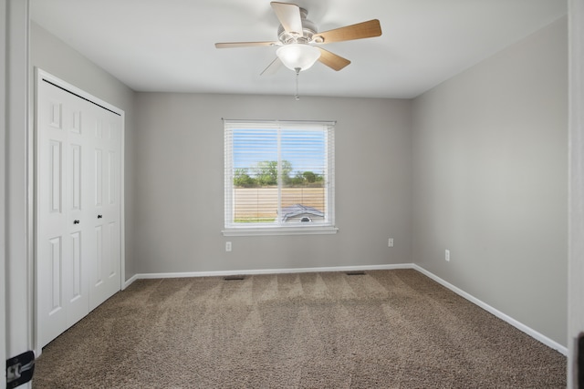 4127 Stone Post Rd, Newport, MI 48166 - unfurnished bedroom featuring baseboards, carpet flooring, a closet, and a ceiling fan