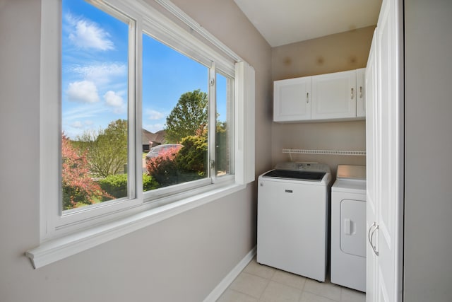 4127 Stone Post Rd, Newport, MI 48166 - laundry area with cabinet space, washer and clothes dryer, healthy amount of natural light, and baseboards