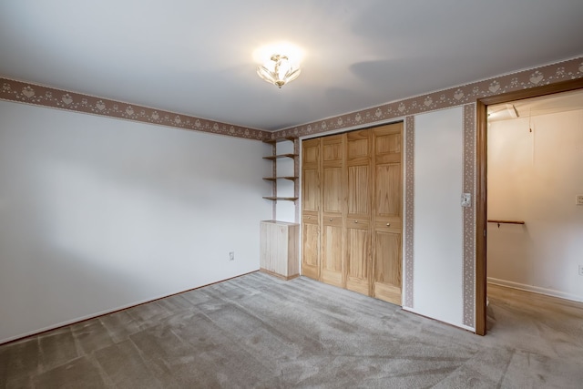 841 Driburg Dr, Commerce Twp, MI 48390 - unfurnished bedroom featuring wallpapered walls, carpet, and a closet