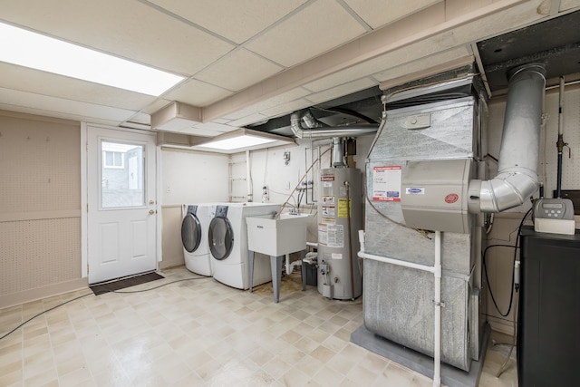 841 Driburg Dr, Commerce Twp, MI 48390 - laundry area with water heater, independent washer and dryer, and light floors