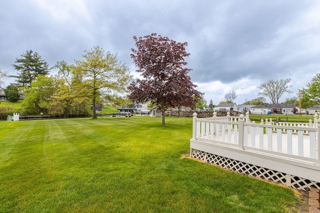 841 Driburg Dr, Commerce Twp, MI 48390 - view of grassy yard with a wooden deck and a residential view
