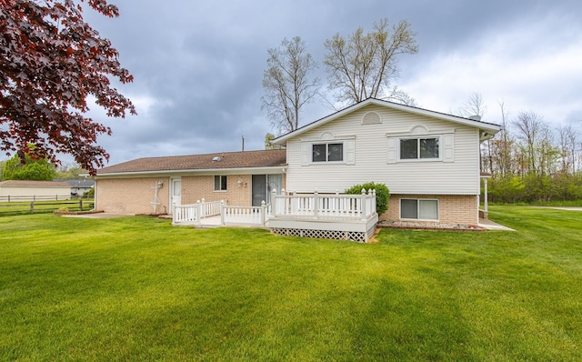 841 Driburg Dr, Commerce Twp, MI 48390 - back of house featuring a deck and brick siding