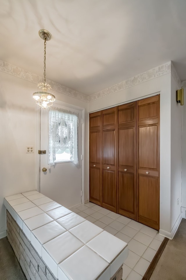 841 Driburg Dr, Commerce Twp, MI 48390 - unfurnished bedroom with a closet, baseboards, and a chandelier