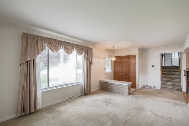 841 Driburg Dr, Commerce Twp, MI 48390 - unfurnished living room with baseboards and stairs