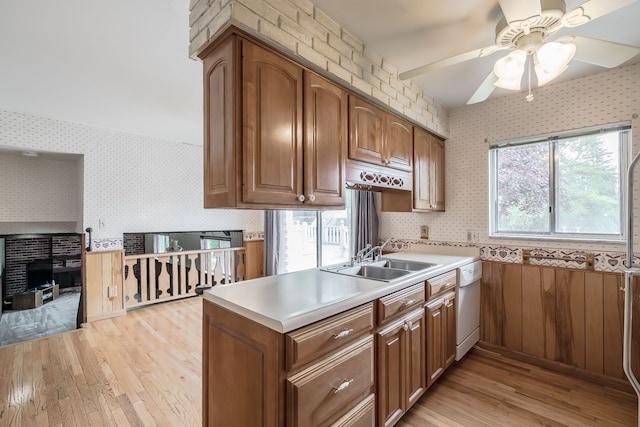 841 Driburg Dr, Commerce Twp, MI 48390 - kitchen featuring a sink, wallpapered walls, white dishwasher, light wood-style flooring, and a ceiling fan
